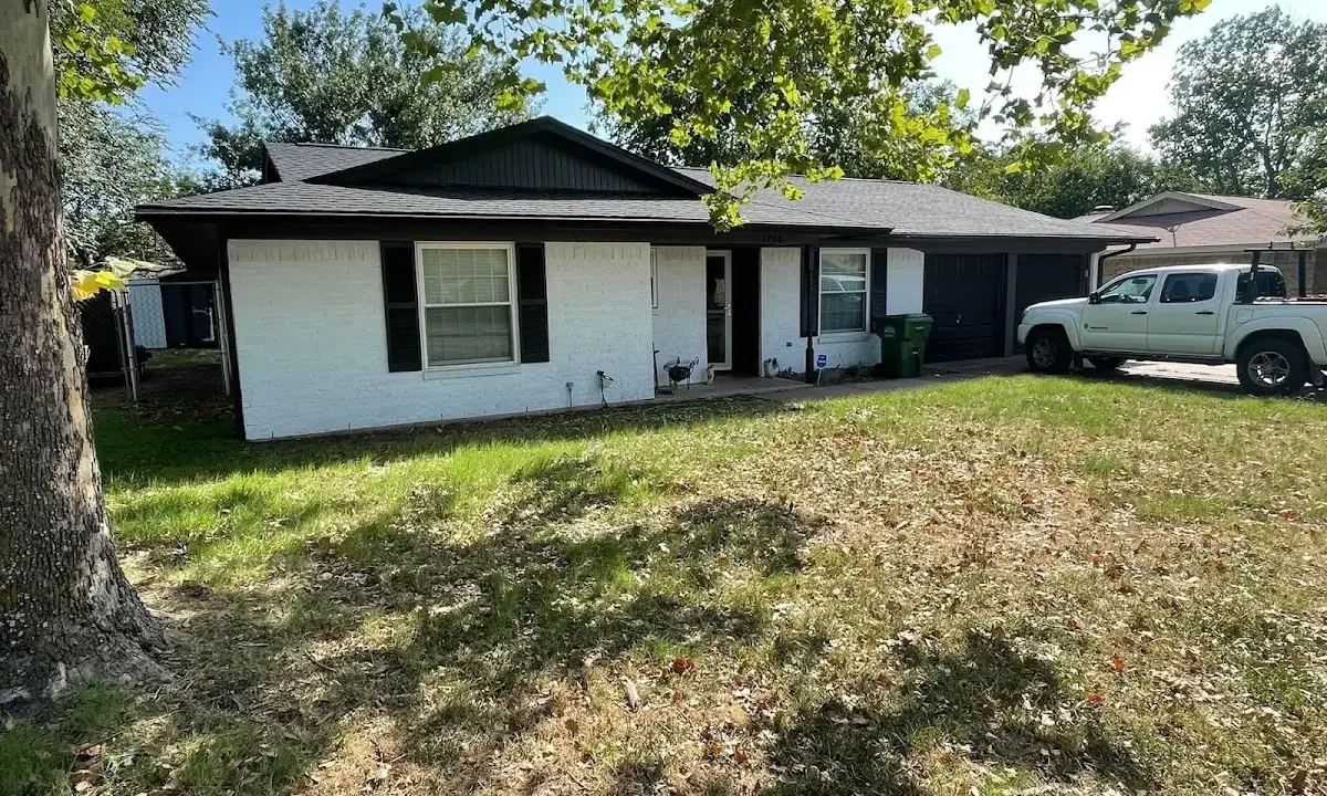 Professional roofing crew working on a residential roof in Lewistown